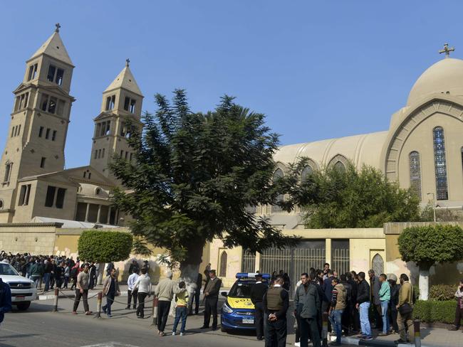 Egyptian security forces gather outside the Saint Peter and Paul Coptic Orthodox Church after it was hit by an explosion. Picture: AFP/Khaled Desouki