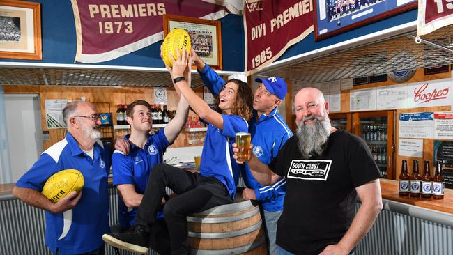 Hugh Tedmanson (complex manager), Nick Steele, Jesse Vaughan, Clint Howes (coach) and Scott Zrna (brewer) at Port Noarlunga Football Club, Port Noarlunga. The club has brewed a Cockle Diver Ale which the club has on tap. Picture: AAP Image/Keryn Stevens.