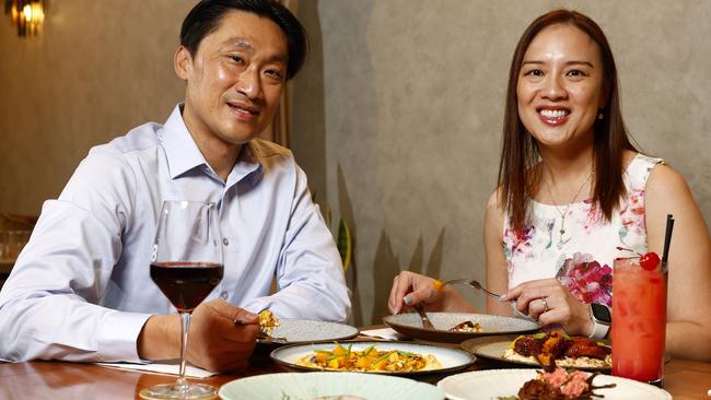 DAILY TELEGRAPH JUNE 4, 2025. Huy Luu and husband Long Pham dining out at Coro 88 Burwood which is offering a yuzu-pickled squid and seafood bisque foam for $10 and a miso caramel desert for the same price. Picture: Jonathan Ng