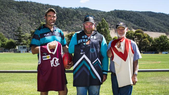 Memories: Omeo-Benambra’s Darren Hayward with the Omeo jumper, David Pooley with the current jumper and Russell Pendergast with the Benambra jumper. Picture Dannika Bonser