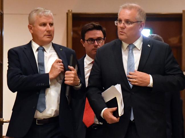 Deputy Prime Minister Michael McCormack and Prime Minister Scott Morrison arrive to address the Bushfire Relief and Recovery Efforts Peak Body Roundtable in the Cabinet Room of Parliament House in Canberra, Friday, January 17, 2020. (AAP Image/Mick Tsikas) NO ARCHIVING