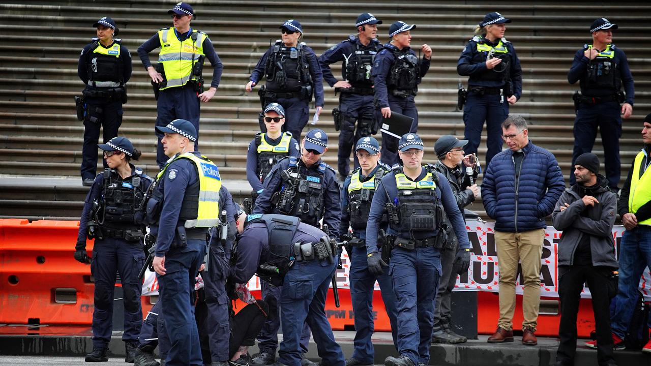 Victorian police formed a line on Spring St in Melbourne’s CBD. Picture: NCA NewsWire / Luis Enrique Ascui