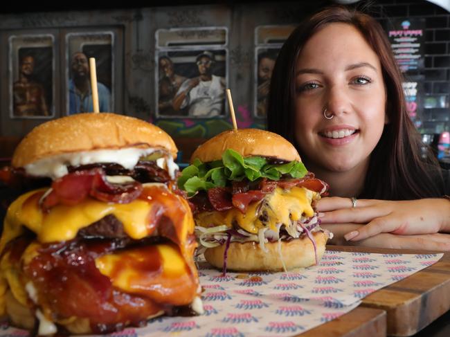 Milky Lane in Surfers Paradise bartender Hayley Yaworski with some burgers. Picture Glenn Hampson