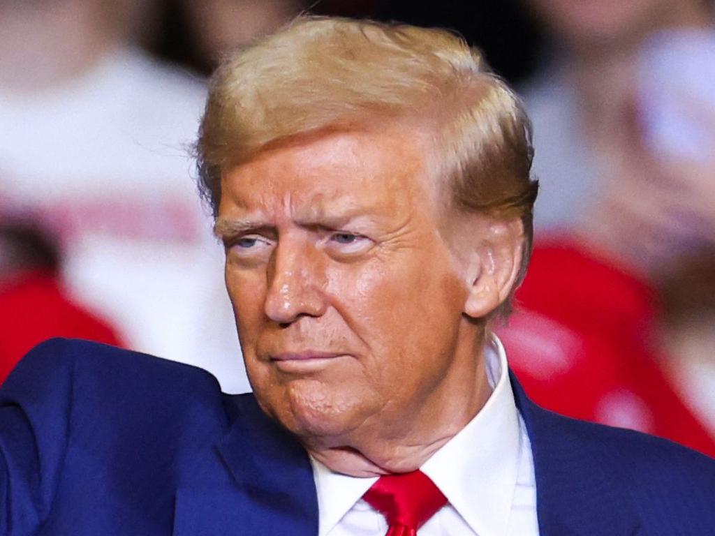 Former US President and Republican presidential candidate Donald Trump leaves the stage after a campaign rally at the Bryce Jordan Center in State College, Pennsylvania, October 26, 2024. (Photo by Charly TRIBALLEAU / AFP)