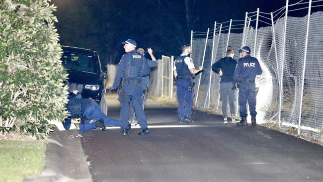 Police conduct evidence searches near a house where a fatal stabbing occurred in Riverstone. Picture: Steve Tyson
