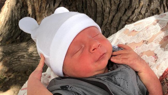 Caitlan Taylor with her new baby Huxlee Kahle, who she didn't she for four days due to Queensland border restrictions.