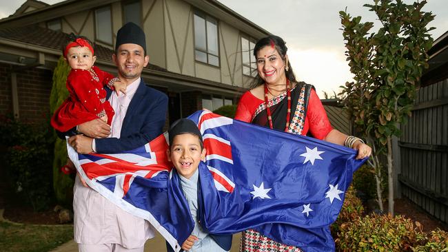 Nepalese migrant Tara Gaire with his wife Shikha and son Subodh and daughter Tashiya at home in Epping. Picture: Ian Currie