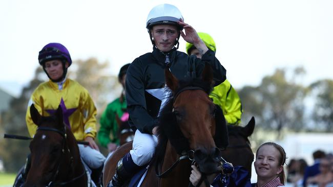 Tom Sherry returns to scale on Unspoken after scoring the biggest win of his career in the $2m Five Diamonds. Picture: Getty Images