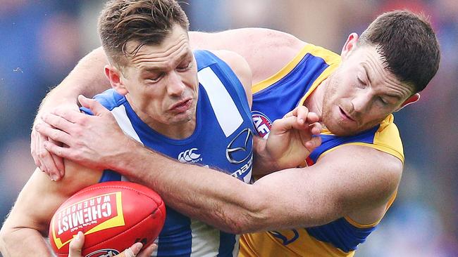 Kangaroo Shaun Higgins and Eagle Jeremy McGovern do battle during last year’s clash in Perth. Picture: Michael Dodge/Getty Images