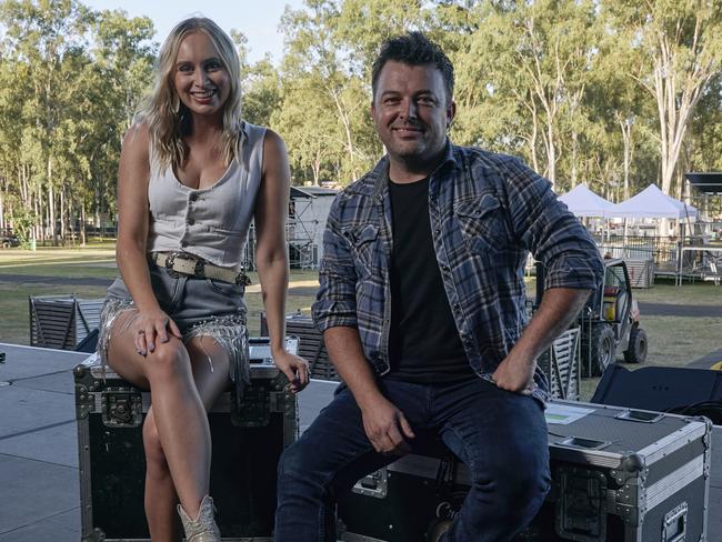 ***EXCLUSIVE FOR THE AUSTRALIAN ONLY***, 13/03/2024: Australian singer-songwriters Melanie Dyer (left) and Travis Collins (right) on site at CMC Rocks QLD, a popular country music festival held annually at Willowbank Raceway, 55km southwest of Brisbane. Picture: Maclay Heriot