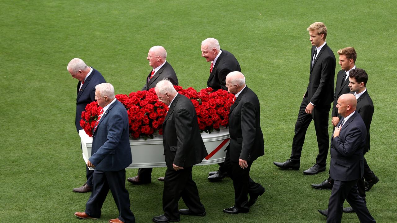 John Raper’s brothers Gerard, Peter, Michael, Paul, Maurie and Ronnie carry his coffin onto the Sydney Cricket Ground. Picture: Brendon Thorne/Getty Images