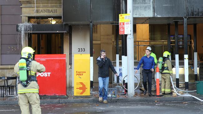 The blaze has been extinguished but Macquarie Street remains closed. Picture: John Grainger