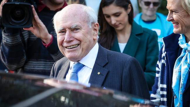 Former Prime Minister John Howard with Liberal MP for Higgins Katie Allen at a polling station in Malvern, Melbourne. Picture: Ian Currie