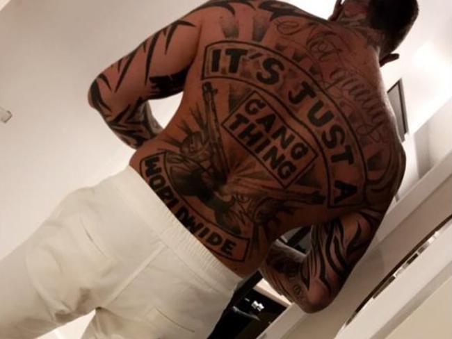 Kaos Pechey has ‘Not guilty’ inked across his back along with multiple tattoos.