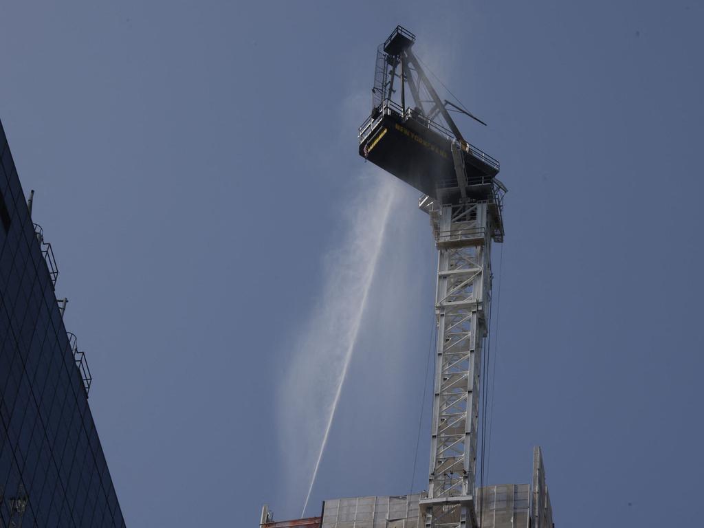 Firefighters battle a fire on a construction crane in New York. Picture: AFP