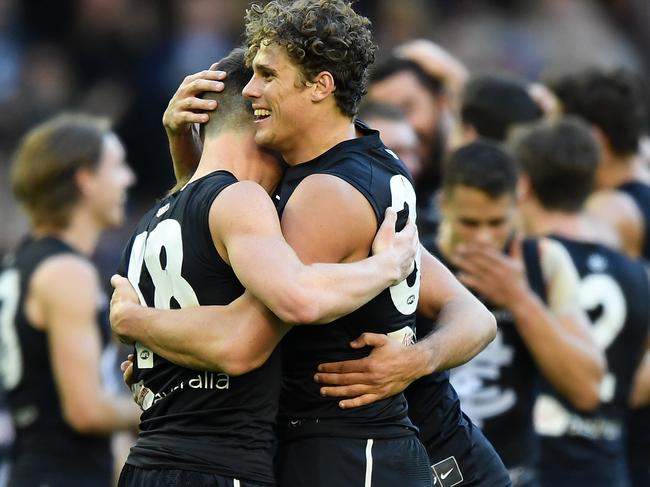 Charlie Curnow (right) and David Cuningham of the Blues react after the Round 12 AFL match between the Carlton Blues and the Brisbane Lions at Marvel Satdium in Melbourne, Saturday, June 8, 2019. (AAP Image/Julian Smith) NO ARCHIVING, EDITORIAL USE ONLY