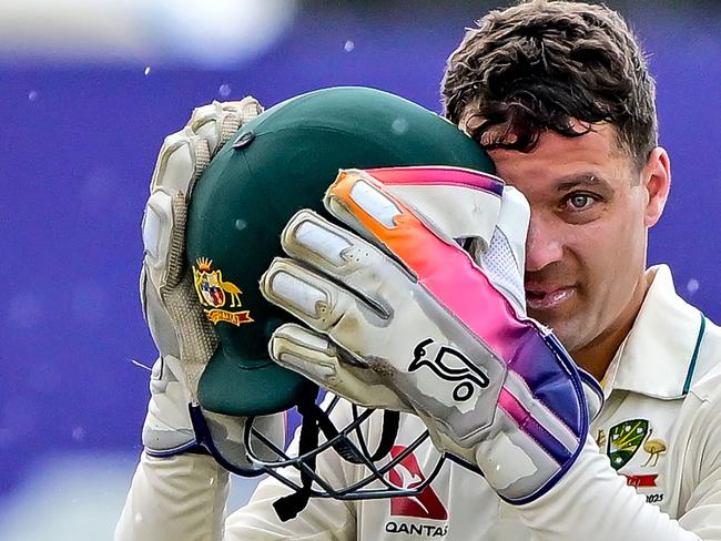 Australia's Alex Carey looks on as he walks off the field after rain halts play during the third day of the first Test cricket match between Sri Lanka and Australia at the Galle International Cricket Stadium in Galle on January 31, 2025. (Photo by Ishara S. KODIKARA / AFP)