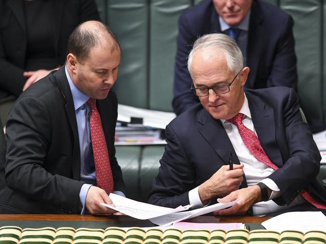 Prime Minister Malcolm Turnbull (right) speaks to  Energy Minister Josh Frydenberg during House of Representatives Question Time at Parliament House in Canberra, Tuesday, August 21, 2018.  (AAP Image/Lukas Coch) NO ARCHIVING