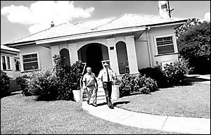 Crime prevention officer Snr Const Michael Hogan (left) and Supt Bruce Lyons conduct a doorknock yesterday.