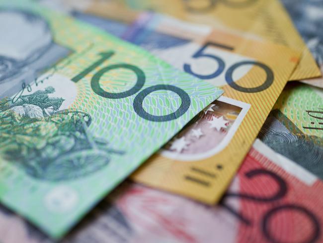 Australian money background showing $100, $50 and $20 notes with a shallow depth of field.