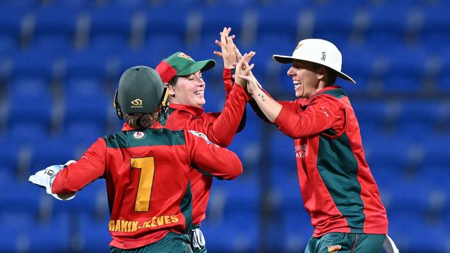 HOBART, AUSTRALIA - FEBRUARY 25: Maisy Gibson, Elyse Villani and Emma Manix-Geeves of the Tigers celebrate the wicket of Emma de Broughe of the Scorpions during the WNCL Final match between Tasmania and South Australia at Blundstone Arena, on February 25, 2023, in Hobart, Australia. (Photo by Steve Bell/Getty Images)