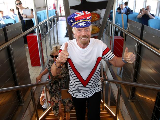 Sir Richard Branson greets commuters. Picture: Toby Zerna