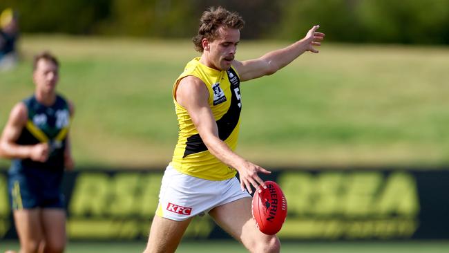 MELBOURNE, AUSTRALIA - APRIL 13: Tom McCarthy of the Tigers kicks during the Marsh AFL National Academy Boys match between Australia U18 and Richmond VFL at RSEA Park on April 13, 2025 in Melbourne, Australia. (Photo by Josh Chadwick/AFL Photos)