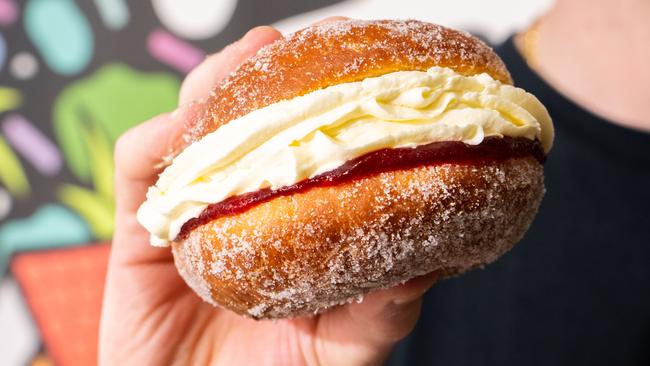 David Matkovic, owner of Brighton Jetty Bakery holding a kitchener bun at the bakery in Brighton/ Kaurna Yarta on Friday, May 12, 2023. (The Advertiser/ Morgan Sette)