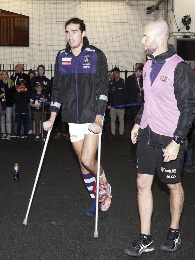 Alex Pearce of the Dockers is seen on crutches after the Round 11 AFL match between the Collingwood Magpies and the Fremantle Dockers at the MCG in Melbourne, Saturday, June 1, 2019. (AAP Image/Daniel Pockett) NO ARCHIVING, EDITORIAL USE ONLY