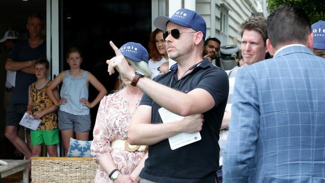 Don’t forget to take an umbrella if you’re planning to attend one of the 100 auctions across Greater Brisbane on Saturday. Picture: Steve Pohlner