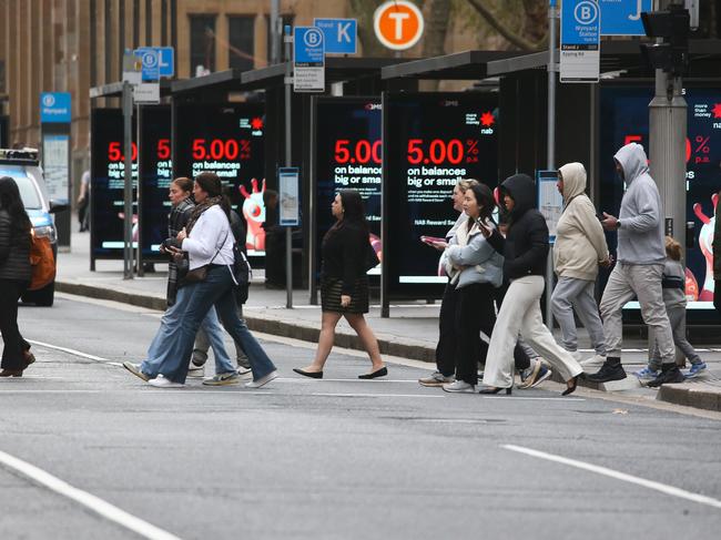 SYDNEY, AUSTRALIA : Newswire Photos- JULY 16 2024: A general stock photo of people crossing York Street at Wynyard Station alongside the bus stops in the Sydney CBD near Wynyard Station. Picture: Newswire /Gaye Gerard