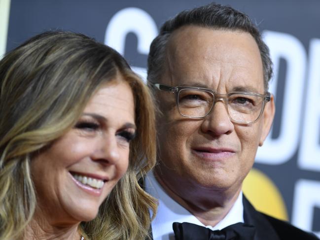 (FILES) In this file photo US actor Tom Hanks and wife Rita Wilson arrive for the 77th annual Golden Globe Awards on January 5, 2020, at The Beverly Hilton hotel in Beverly Hills, California. - March 11, 2020 Tom Hanks announces positive test for coronavirus. (Photo by VALERIE MACON / AFP)