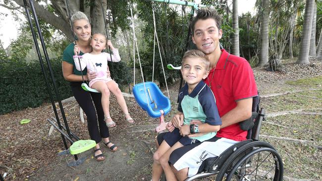 Former professional motorbike racer Matt Kuhne would love to be more active with wife Kylie Kuhne and kids Levi, 6, and Aisha, 4. Picture: Mike Batterham