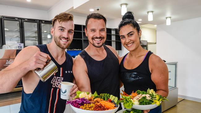 Jono Carmody, owner Bodie Milsom and Zainab Ayubi at the new Muscle Bar Cafe at North Adelaide. Photo: AAP/Roy Vandervegt