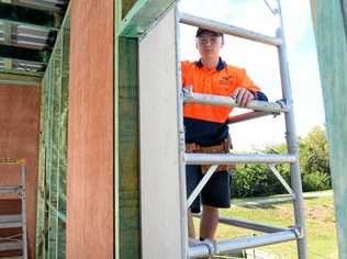 Callum Mahoney gets to work on the 'Building Futures Program' house at North Ipswich. Picture: Rob Williams