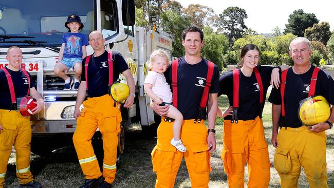 Mt Barker and CFS Heysen Group volunteers (L-R) Group Officer Nathan Watts, Lt Rob Kamminga and his son Angus, 7, Lt Robert Lancaster with his daughter Chelsea, 2, and Firefighter Emma Chapman with her father, Captain Andrew Chapman, are all hoping to spend Christmas Day with family. Picture: DYLAN COKER