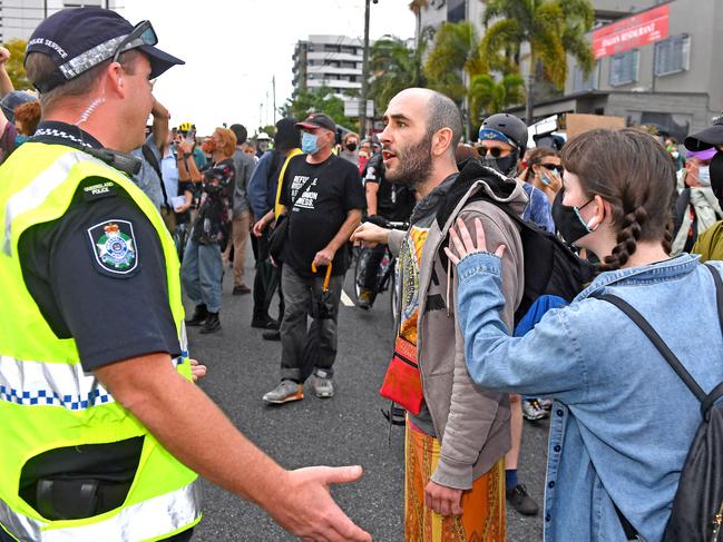 A heated moment as protesters are moved on. Picture: John Gass