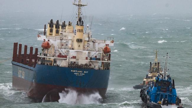 A bulk carrier with 21 crew members on board is at risk again after tug lines snapped overnight during rough seas. Picture: Mark Sundin