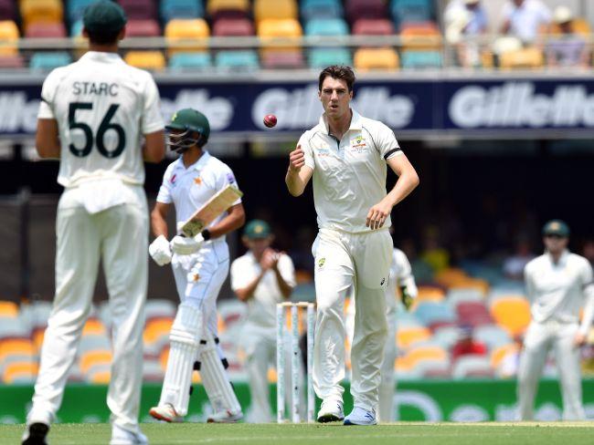 Pat Cummins (C) was the pick of the Australian bowlers. Picture: AFP