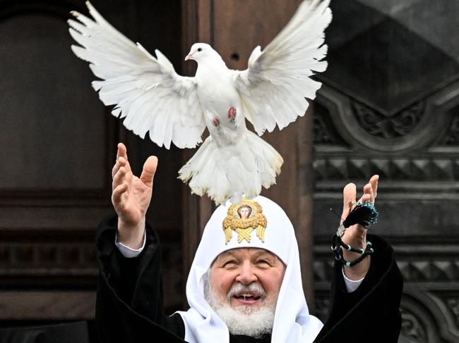 Russian Orthodox Patriarch Kirill releases white dove after a mass marking the Holiday of Annunciation in Moscow on April 7, 2022.