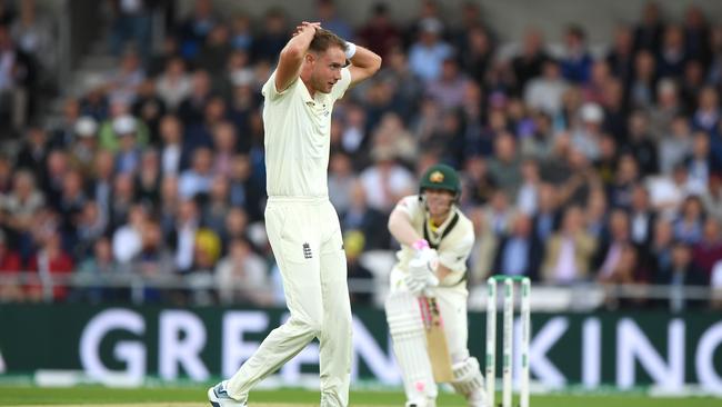 Play and miss ... again. Stuart Broad can’t believe he hasn’t found the outside edge of David Warner’s bat. Picture: Getty Images