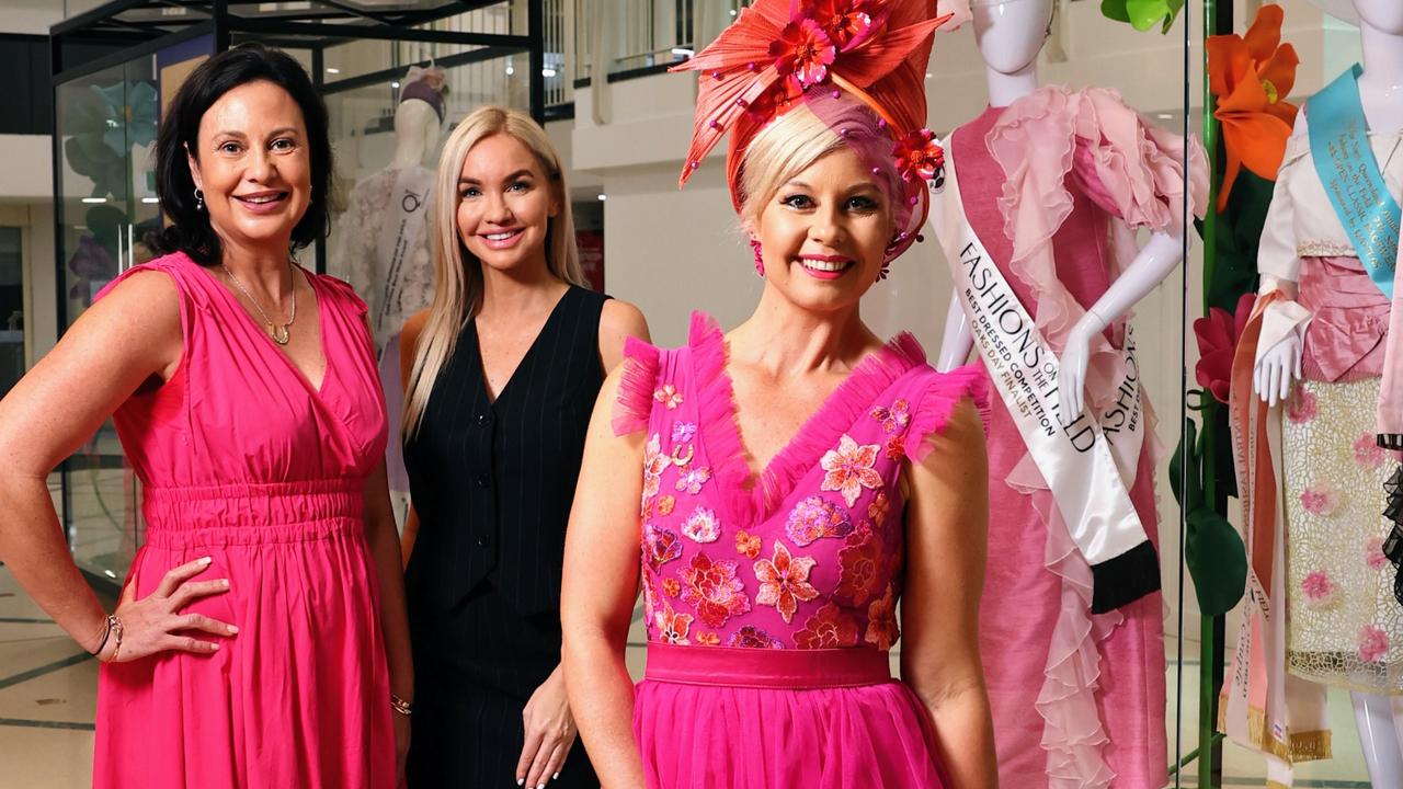 Cairns Amateurs steering committee member Rebecca Conlan, Cairns Central marketing manager Louise Struber, and Kymberlee Cockrem, admire the display of winning fashion. Picture: Brendan Radke