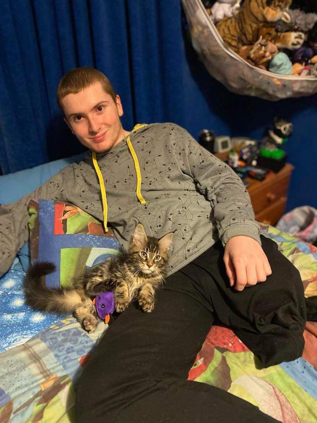 Kyle McCarthy 15 with his cat Smokey before he passed away from cancer. Picture: supplied by the family