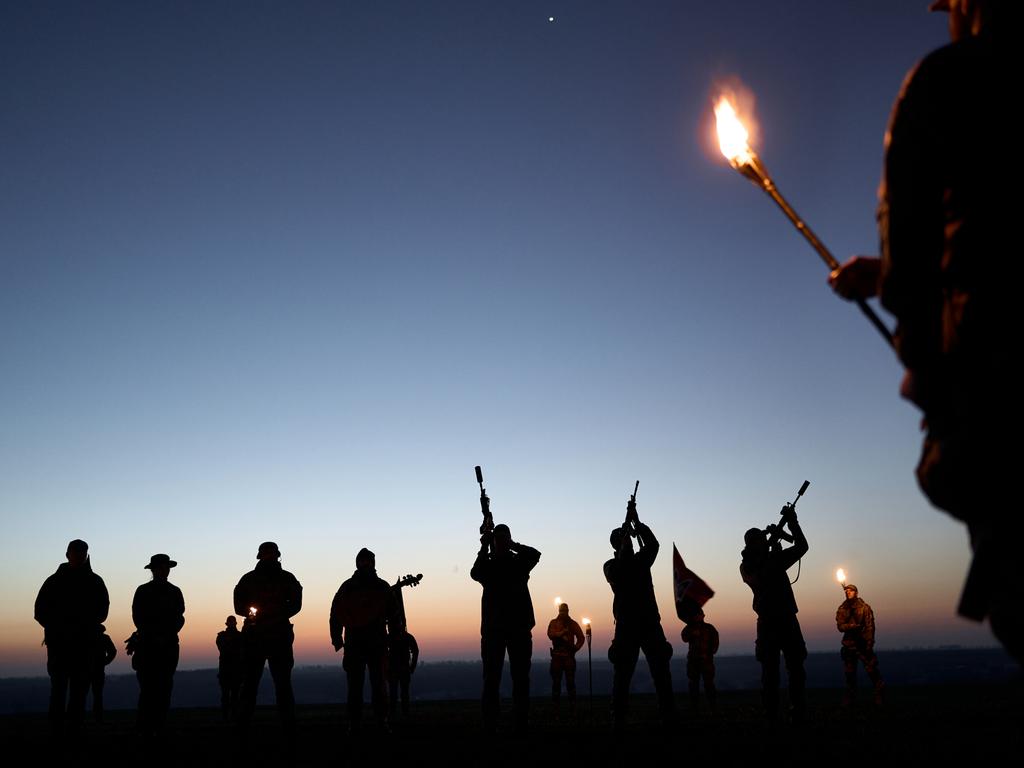 Servicemen gather at dawn to honour fallen Ukrainian commander Dmytro 