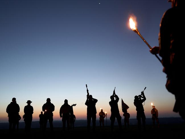 Servicemen gather at dawn to honour fallen Ukrainian commander Dmytro "Da Vinci" Kotsiubailo - the youngest in the army’s history - on his birthday. Picture: Kostya Liberov/Libkos/Getty Images