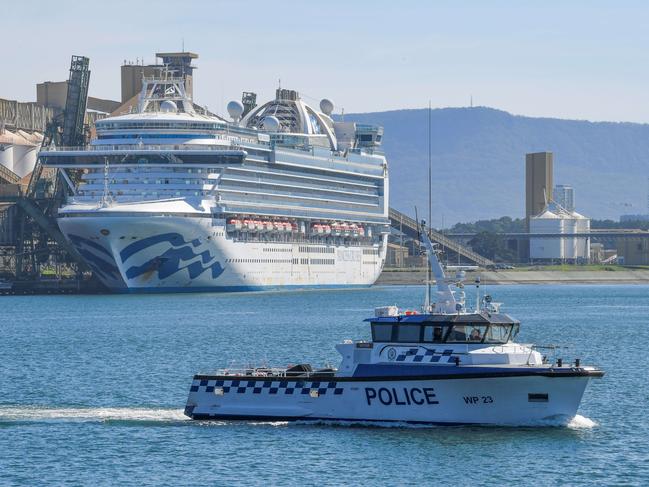 Water police patrol the then-contaminated cruise ship Ruby Princess. Picture: Simon Bullard