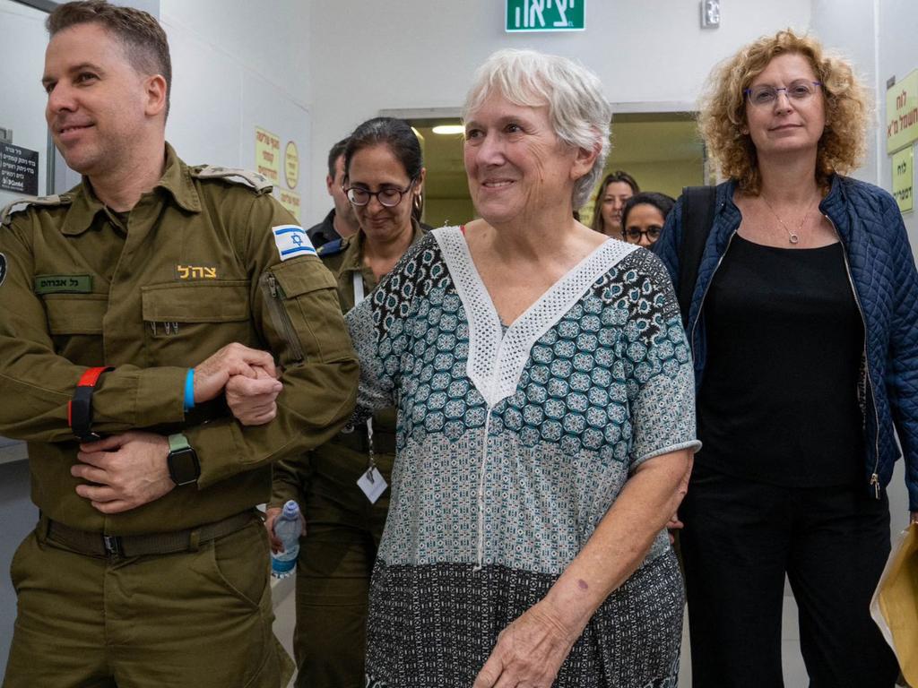 Former captive Margalit Moses escorted by a soldier into a hospital in Israel, following her release by Hamas in Gaza. Picture: Israel Army / AFP