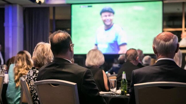 Michael 'Juice' Shepheard (centre and on the screeen) pictured at the club presentation night where he was made a Life Member. Picture: MWDCC