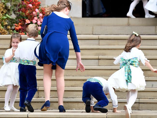 Princess Charlotte of Cambridge (left) arrives with bridesmaids and pageboys for the wedding of Britain's Princess Eugenie. Picture: AFP