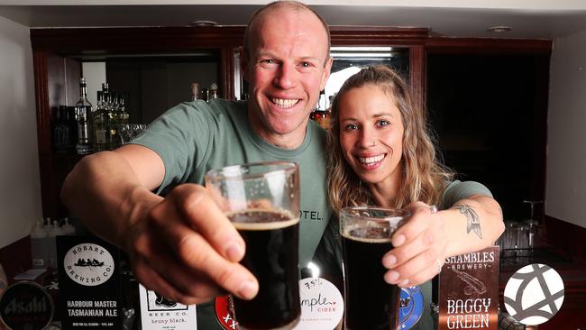 Paul Stewart and Sarah James bar staff at the Crescent Hotel that has reopened in North Hobart. Picture: NIKKI DAVIS-JONES